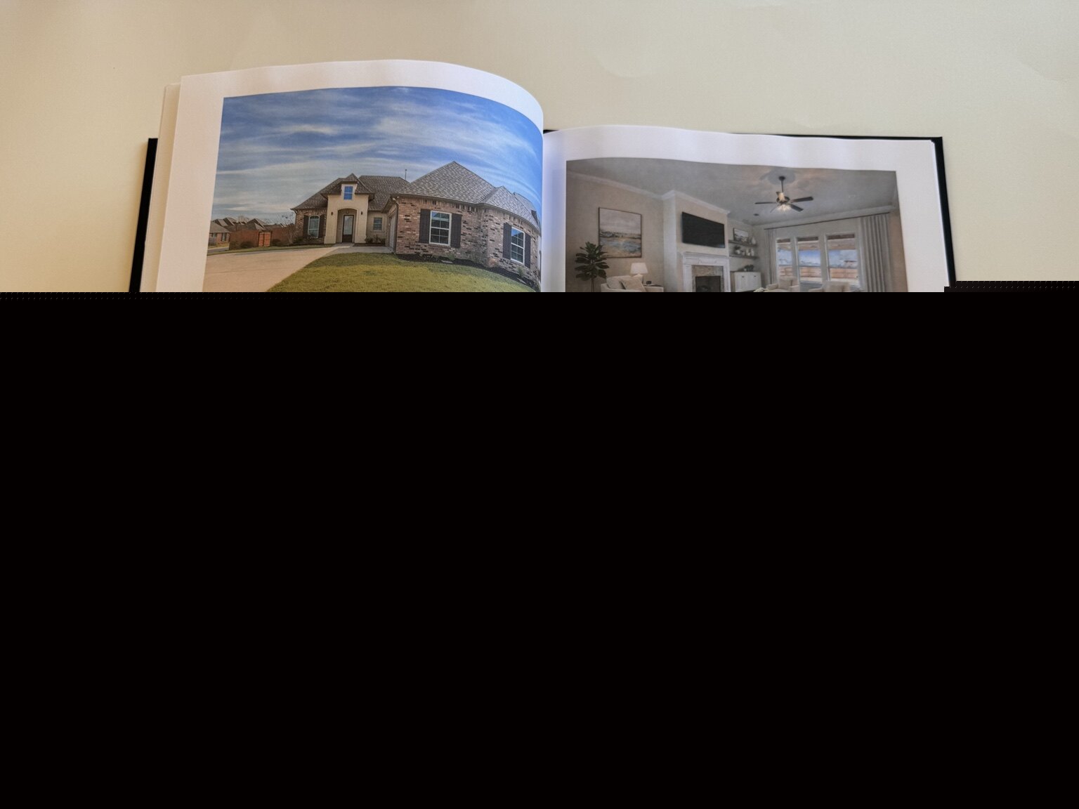 Professional photographs of 301 Brianna Lane presented inside the property information book